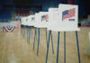 The Next Front In Election Security Voting booths lined up in a gymnasium.