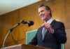 Man speaking at podium with microphone