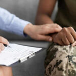 High-Test Recruits Headed To Marines? Person comforting someone in military uniform with clipboard