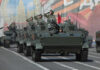 Military tanks in formation during a parade
