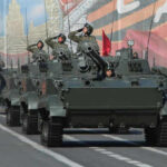 Military tanks in formation during a parade