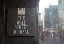 President Trump’s $10 Billion Lawsuit Hits New Wall Sign for The Wall Street Journal on a building in a busy city street