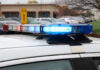 LA Chase Ends in Deadly Freeway Gunfight Close-up of a police car's emergency lights in a parking lot