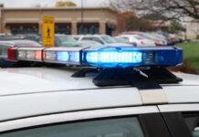 LA Chase Ends in Deadly Freeway Gunfight Close-up of a police car's emergency lights in a parking lot