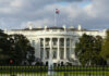 AI Roosevelt Crashes The White House The White House with an American flag flying above it