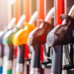 Colorful fuel nozzles at a gas station