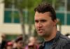 A TV Appearance Sparks Legal Chaos Man speaking outdoors at a public gathering