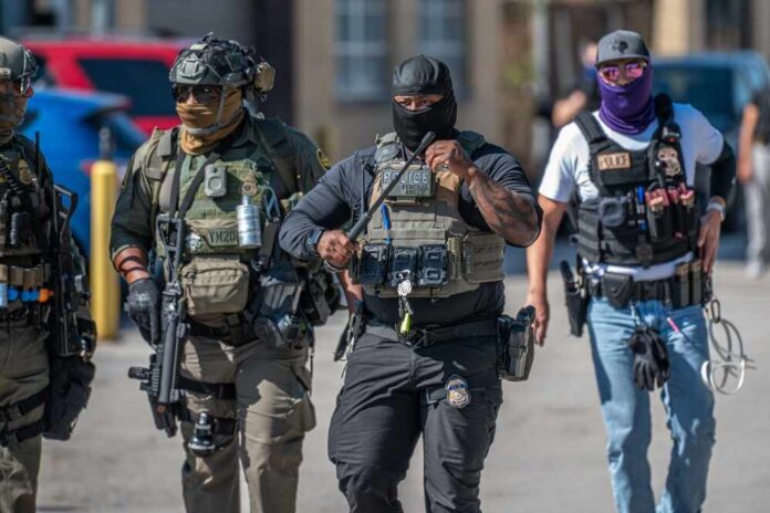 Broadview,,Illinois,,Usa,-,09-26-2025,Protest,At,The,Ice,Processing Group of police officers in tactical gear walking in an urban area