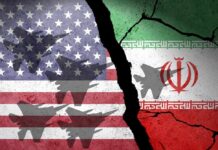 A cracked wall featuring the flags of the United States and Iran, with military aircraft silhouettes