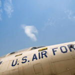 Close-up view of a U.S. Air Force aircraft against a blue sky