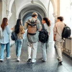 Federal Review Targets California School Districts Five students walking in a school hallway together