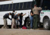 People being searched by border patrol officers
