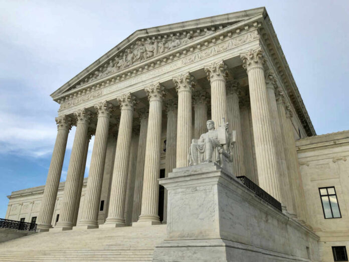 us-supreme-court2134702923jpg United States Supreme Court building with columns and statue