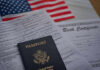 Denaturalization Dragnet Expands—Who’s Next? Passport and documents on table with American flag