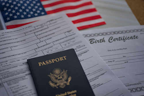 usa-birthright-citizenship1629072466jpg Passport and documents on table with American flag