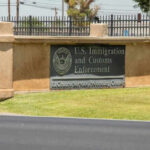 Watchdog Blasts ICE’s Mega Camp Sign for U.S. Immigration and Customs Enforcement building.
