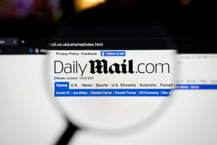 daily-mail-company-logo-on-a-website1999264064jpg Daily Mail website under magnifying glass showing headlines