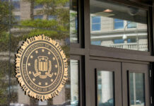 Newsom Orbit Rocked By FBI Sting FBI seal on building entrance