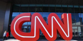 CNN red logo sculpture outside a building entrance