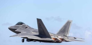 Stealth fighter jet taking off from runway