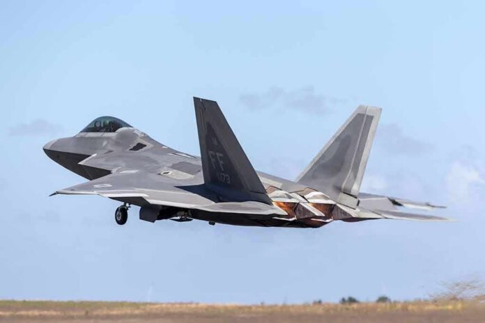 shutterstock_1570854730 Stealth fighter jet taking off from runway