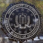 FBI: Hate-Crime Hoax Plot Exposed FBI seal on a building wall