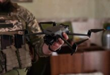Starlink Moves To The Center Of The Ukraine War soldier holding a quadcopter drone