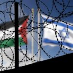 Separated By War, Finally Reunited As Family Barbed wire coils with blurred Palestinian and Israeli flags in background