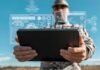 New Marine Network Keeps AI Alive A soldier holding a tablet displaying digital data overlays