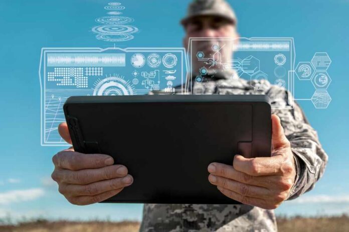 Ai,Technology,In,The,Army.,Warfare,Analytic,Operator,Checking,Coordination A soldier holding a tablet displaying digital data overlays