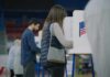 Noncitizen Voting Case Draws National Attention A person casting their vote at a polling station