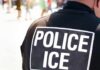 After Fatal Encounters, ICE Changes Course Close-up of a police officer's back with a 'POLICE ICE' badge