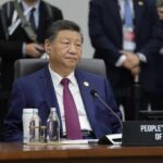 China Pushes Forward With Military Overhaul Senior official in a blue suit sits at an international conference table