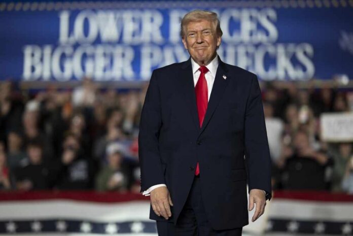 Clive,,Iowa,,United,States,,January,27,,2026,,President A speaker at a political rally smiling in front of a cheering crowd