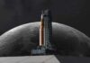 A rocket on a launch pad with the moon in the background