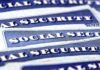 Washington Stalls, Social Security Bleeds Out Stacked U.S. Social Security cards