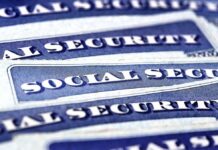 Washington Stalls, Social Security Bleeds Out Stacked U.S. Social Security cards
