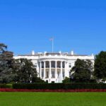 Teleprompter Mole Cashes In—Then Pays The White House facade with flag and gardens