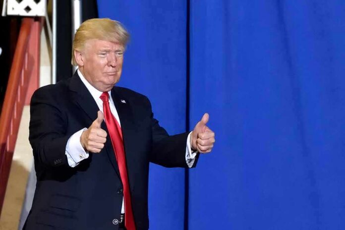shutterstock_1087344797 man in suit giving two thumbs up