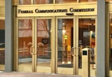 Behind America’s Screens, Ownership Keeps Concentrating Federal Communications Commission building entrance with glass doors