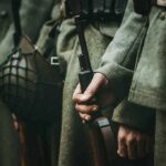 Behind the Recruiting Pitch Was Something Much Darker Soldiers in wool uniforms holding rifles