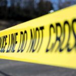 Fatal Hit-and-Run Draws Swift Action From ICE Yellow police tape stretched across an outdoor scene