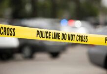 Family’s Fight to Save Son Ends Tragically Yellow police line tape at a blurred street scene
