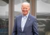 Hunter Biden Shares a Painful Update on His Father smiling older man in a blue suit standing outdoors
