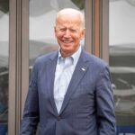 Hunter Biden Shares a Painful Update on His Father smiling older man in a blue suit standing outdoors