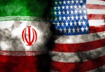 Iran and United States flags with smoky overlay