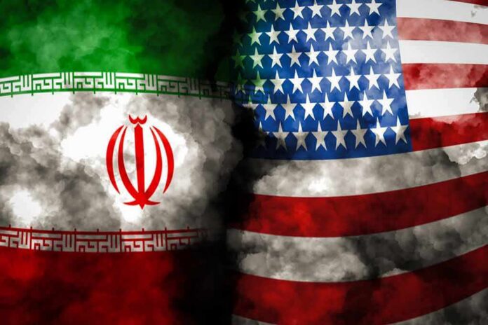 shutterstock_1608547252 Iran and United States flags with smoky overlay