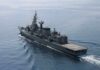 Modern naval warship cruising on calm sea