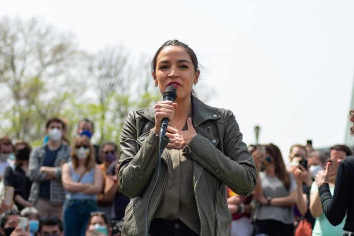shutterstock_1962940828 woman speaking into a microphone at an outdoor rally