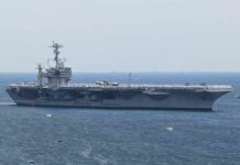 Iran’s Oil Lifeline Is Starting to Choke Aircraft carrier sailing at sea